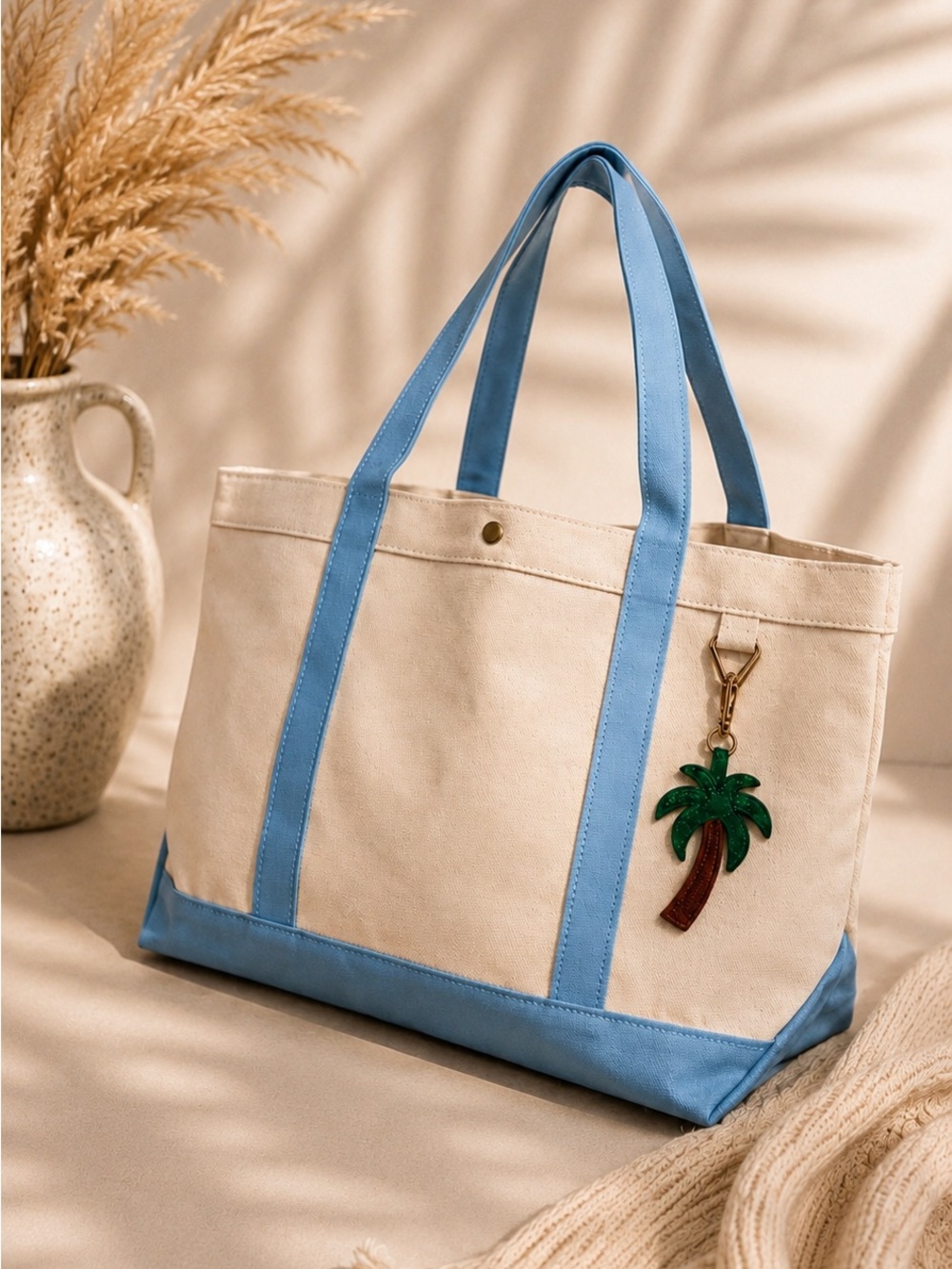 BaubleBar Cream Canvas Tote with Blue Accents and Palm Charm